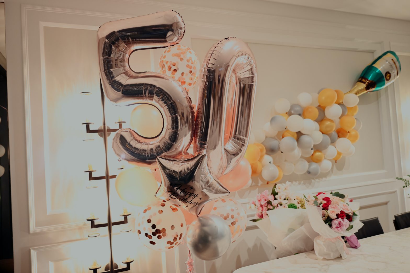 Two pink balloons, a five and a zero to symbolize the process of turning 50.